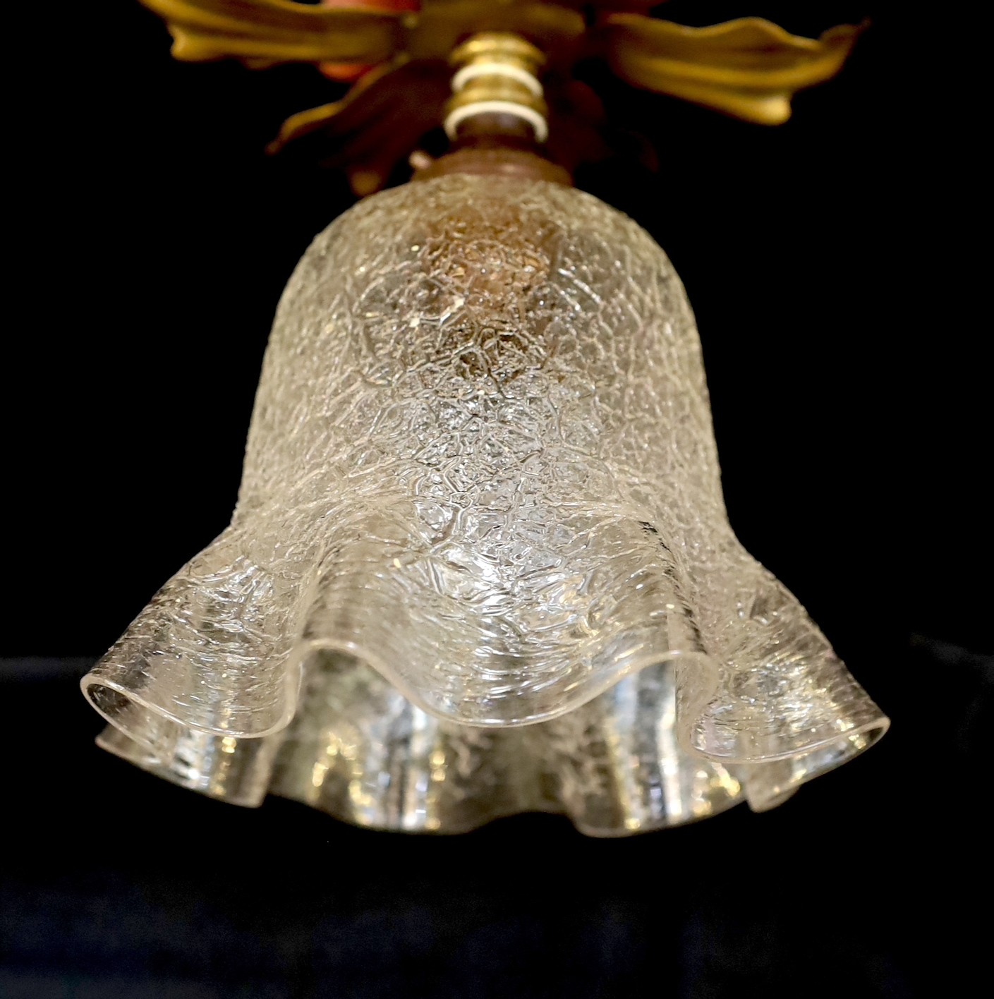 A pair of 1930s English brass ceiling lights of foliate form with crackle glass shades, height 19cm